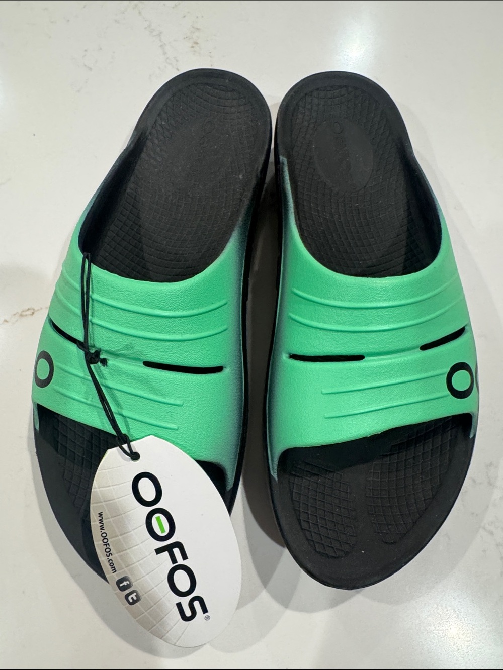 OOFOS Kids Recovery Slide Sandals in Mint Green and Black